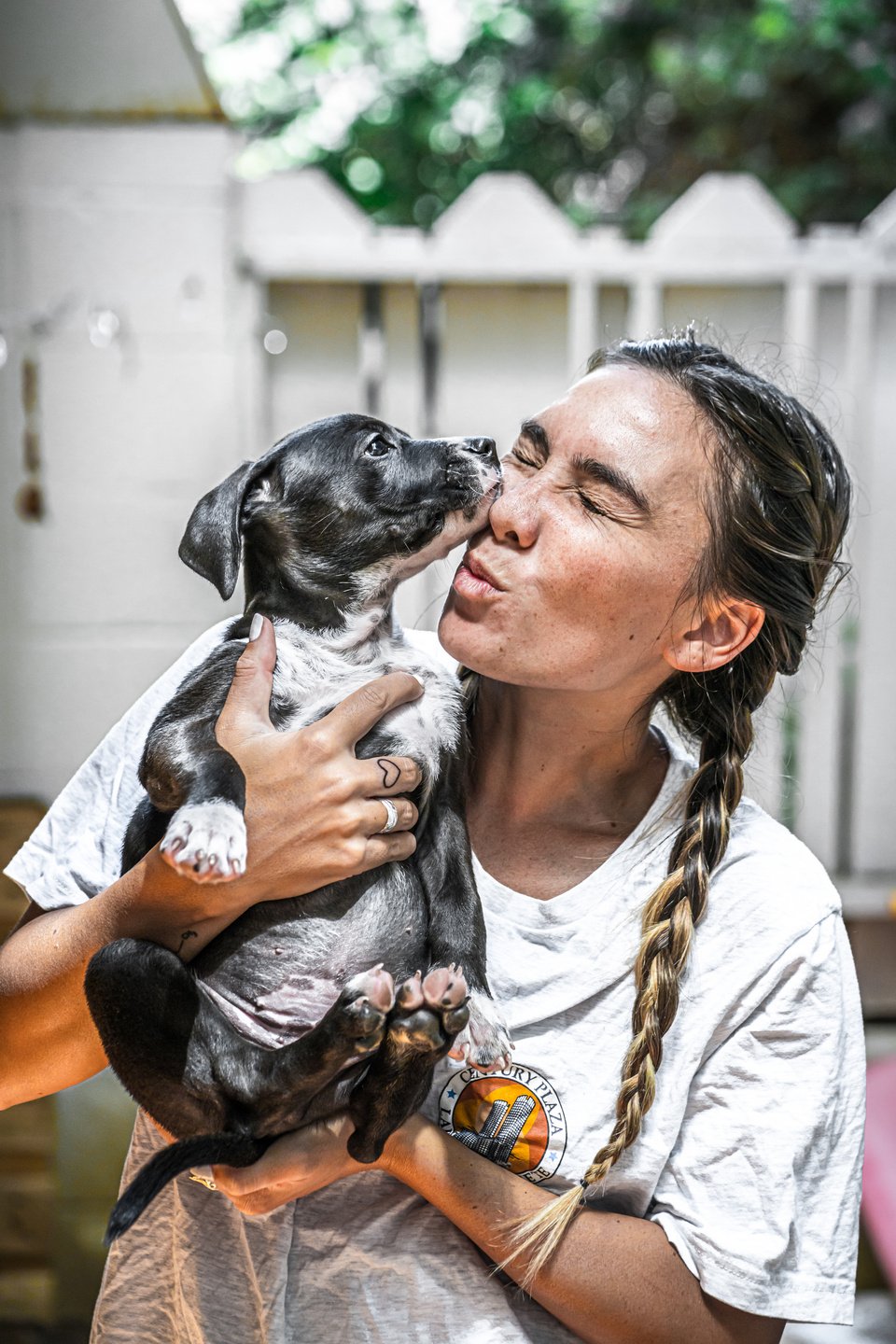 Woman Kissing Dog